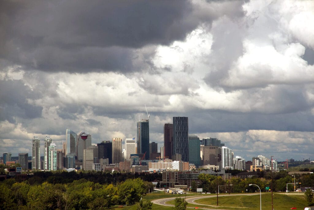 Dark storm clouds over Calgary skyline before a hailstorm